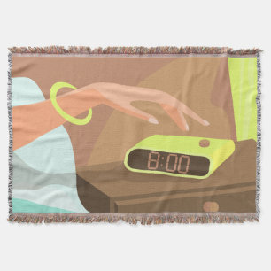 Girls hand pushing on alarm clock snooze button throw blanket