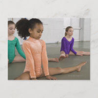 Girls stretching in gymnastics practice