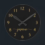 Girly Black Gold Minimalist Monogram Script Round Clock<br><div class="desc">Girly Simple Minimalist Black And Gold Monogram Name Script Custom Personalised Round Clock. These design featuring your first name in a pretty hand lettered style swash tail font signature typography on black and gold. These are easy to customise it. Great stylish feminine housewarming gift, also for birthday, mother’s day, wedding,...</div>