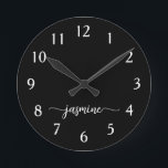 Girly Minimalist Monogram Name Script Black  Round Clock<br><div class="desc">Girly Simple Minimalist Black Monogram Name Script Custom Personalised Round Clock. These design featuring your first name in a pretty hand lettered style swash tail font signature typography white script on black colour background. These are easy to customise it. Great stylish feminine housewarming gift, also for birthday, mother’s day, wedding,...</div>