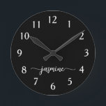 Girly Minimalist Monogram Name Script Black  Round Clock<br><div class="desc">Girly Simple Minimalist Black Monogram Name Script Custom Personalised Round Clock. These design featuring your first name in a pretty hand lettered style swash tail font signature typography white script on black colour background. These are easy to customise it. Great stylish feminine housewarming gift, also for birthday, mother’s day, wedding,...</div>