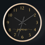 Girly Minimalist Monogram Name Signature Script Clock<br><div class="desc">Girly Simple Minimalist Black And Gold Monogram Name Script Custom Personalised Square Wall Clock. These design featuring your first name in a pretty hand lettered style swash tail font signature typography on black and gold. These are easy to customise it. Great stylish feminine housewarming gift, also for birthday, wedding, bridal...</div>