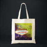Glam Las Vegas Wedding Maid of Honour Gift Tote Bag<br><div class="desc">Big and glamourous Las Vegas strip sign tall palm trees and colourful stars yellow & purple shades background illustrated on custom Maid of Honour Gift Bags. Personalise the artsy and unique tote bags for your maid of honour and/or bridesmaids to thank them! ((You can find the matching wedding essentials &...</div>
