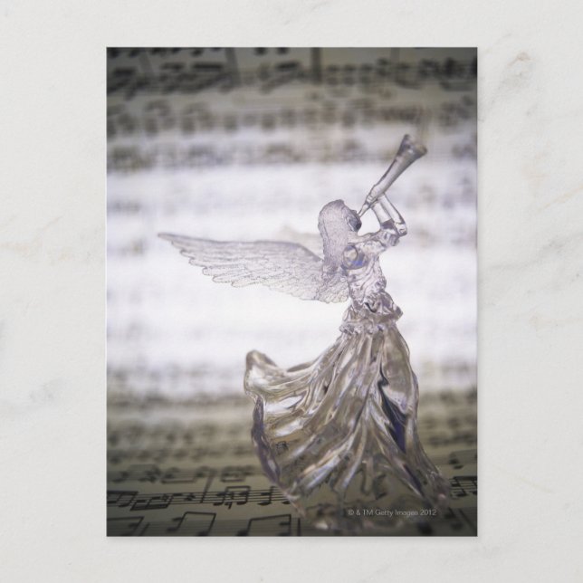 Glass angel playing trumpet and image of sheet postcard (Front)