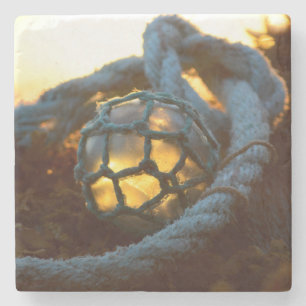 Glass float glows at sunset, Alaska Stone Coaster