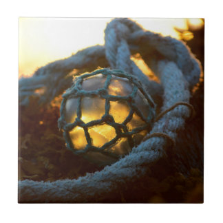 Glass float glows at sunset, Alaska Tile