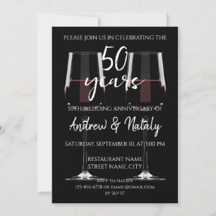 Glass of red wine on black invitation