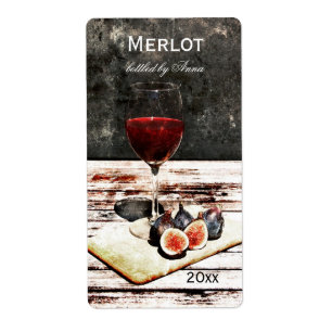 Glass of red wine with figs wine bottle label