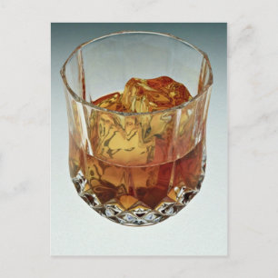 Glass tumbler filled with scotch and ice cubes postcard