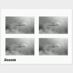 Glider flying in grey sky rectangular sticker