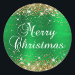 Glittery Gold and Green Foil Merry Christmas Classic Round Sticker<br><div class="desc">Fancy calligraphy Merry Christmas envelope seal stickers for your special holiday greetings or invite.
Girly faux sparkly gold glitter on the top and bottom edge over a faux green brushed metal style ombre foil.
The colour of the old-fashioned text graphic can be changed.</div>