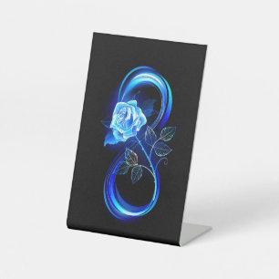 Glowing infinity with blue rose pedestal sign