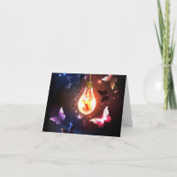Glowing Light Bulb with Night Butterflies