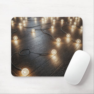 Glowing Light String On a Wood Floor Mouse Pad
