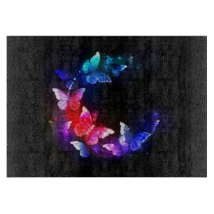 Glowing Neon Night Butterflies on Black background Cutting Board