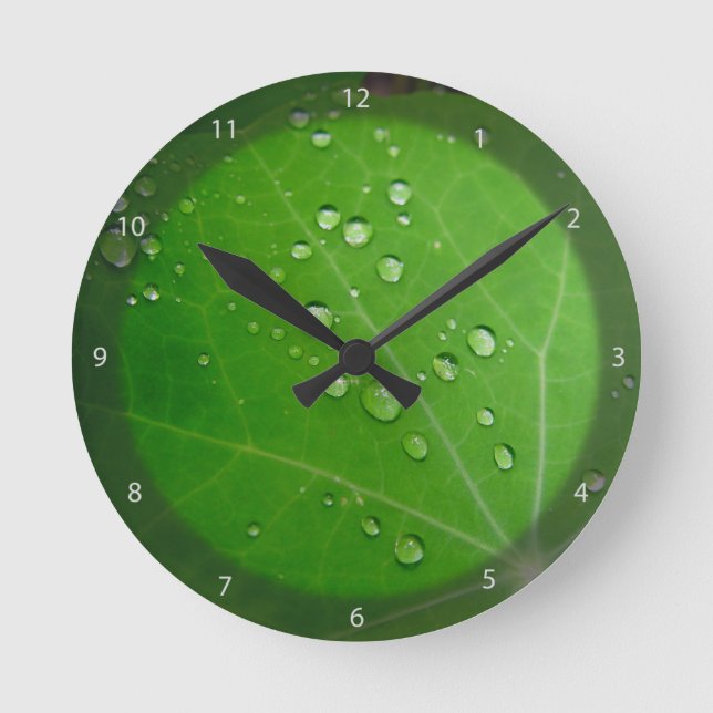 Glowing Raindrops on nasturtium leaf Round Clock (Front)