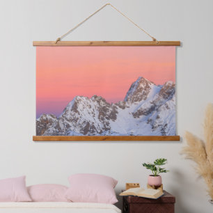 Glowing sunset sky and snowy mountains hanging tapestry