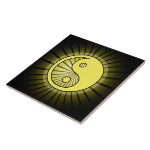 Glowing Yellow Yin Yang over Black Ceramic Tile