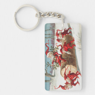 Gnomes dragging a cut tree trunk through the snow key ring