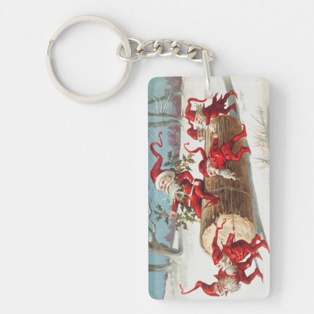 Gnomes dragging a cut tree trunk through the snow key ring (Front)