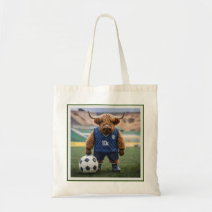 "Goal-Getter: A Highland Cow Dressed for Soccer" Tote Bag