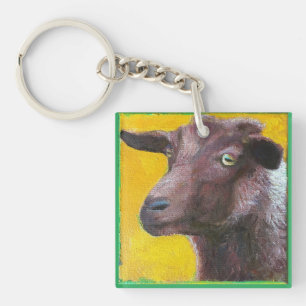 Goat face on yellow background key chain