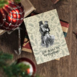 God bless us everyone Dickens Christmas Carol Card<br><div class="desc">An vintage victorian illustration of Bob Cratchit and Tiny Tim from Charles Dickens A Christmas Carol. "A Merry Christmas to us all; God bless us,  everyone!" is Tiny Tim's most famous quote. Here on a vintage green background of holly. You can customise all text to your liking.</div>