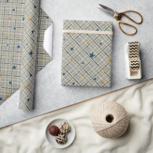 Gold and blue stars on a grey chequered background wrapping paper