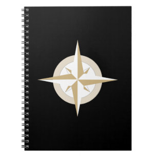 Gold and White Compass on Black Notebook