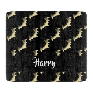 Gold bats on black cutting board