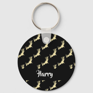Gold bats on black key ring