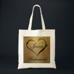 Gold Black Confetti Heart Wedding Welcome Tote Bag<br><div class="desc">Gorgeous luxe wedding welcome bag for a bridesmaid. It all starts with a deep gold background that glows from the centre. A bold swirl of a romantic heart frames her name and the word bridesmaid is written below. A fancy font in black adds to the formal drama. Gold confetti is...</div>
