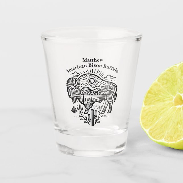 Gold Buffalo Grazing Under The Sun Near Mountains Shot Glass (Front)