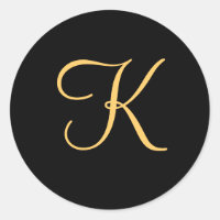 Gold-coloured initial K on black monogram sticker