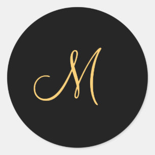 Gold-coloured initial M on black monogram  round Classic Round Sticker