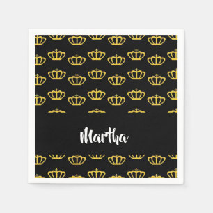 Gold crowns on black napkin