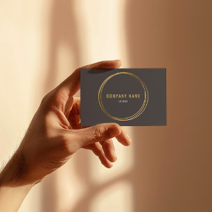 Gold effect, gold rings, grey background bold text business card