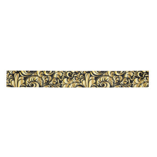 Gold flourish on black satin ribbon