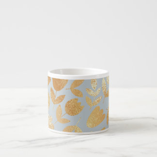 Gold flowers, blue background, foil imitation. espresso cup