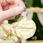 Gold Frills on Cream Bridesmaid Wedding Gift Key Ring<br><div class="desc">These keychains are designed to give as favours to bridesmaids in your wedding party. They feature a simple yet elegant design with an ivory or cream coloured background, gold script lettering, and a lacy golden faux foil floral border. The text says "Bridesmaid" with space for her name, the names of...</div>