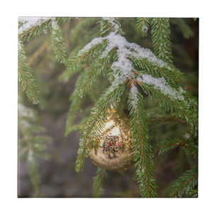 Gold Glass Christmas Ornament On Evergreen Tree Tile