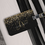 Gold Glitter Glam Monogram Name Luggage Tag<br><div class="desc">Glam Gold Glitter Elegant Monogram Luggage Tag. Easily personalise this trendy chic luggage tag design featuring elegant gold sparkling glitter on a black background. The design features your handwritten script monogram with pretty swirls and your name.</div>