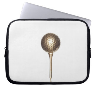 Gold golf ball and tee laptop sleeve