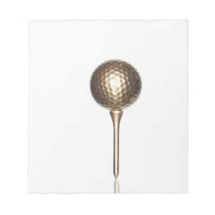 Gold golf ball and tee notepad