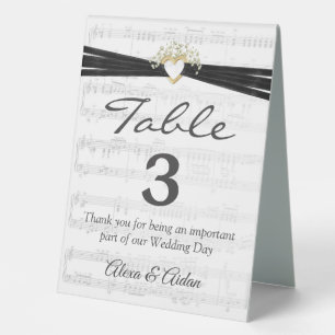 Gold Heart with Ribbon On Sheet Music