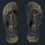 Gold Lace on Black The Bride Elegant Wedding Thongs<br><div class="desc">Dance the night away with these beautiful wedding flip flops. Designed for the bride, they feature a simple yet elegant design with gold coloured script lettering on a classic black background and fancy golden lace curls and swirls. Beautiful way to stay fancy and appropriate while giving your feet a break...</div>