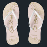 Gold Lace on Blush Pink The Bride Elegant Wedding Thongs<br><div class="desc">Dance the night away with these beautiful wedding flip flops. Designed for the bride, they feature a simple yet elegant design with gold coloured script lettering on a light blush pink background and fancy golden lace curls and swirls. Beautiful way to stay fancy and appropriate while giving your feet a...</div>