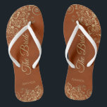 Gold Lace on Rust Orange Elegant The Bride Wedding Thongs<br><div class="desc">Dance the night away with these beautiful wedding flip flops. Designed for the bride, they feature a simple yet elegant design with gold coloured script lettering on a rust orange or burnt umber coloured background and fancy golden lace curls and swirls. Beautiful way to stay fancy and appropriate while giving...</div>