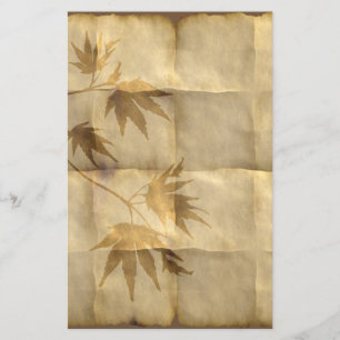 Gold maple leaves on parchment paper elegant