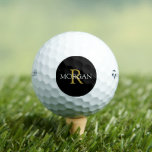 Gold Monogram & White Name on Black Circle Golf Balls<br><div class="desc">Personalise your monogram in gold and name In white on black circle.</div>